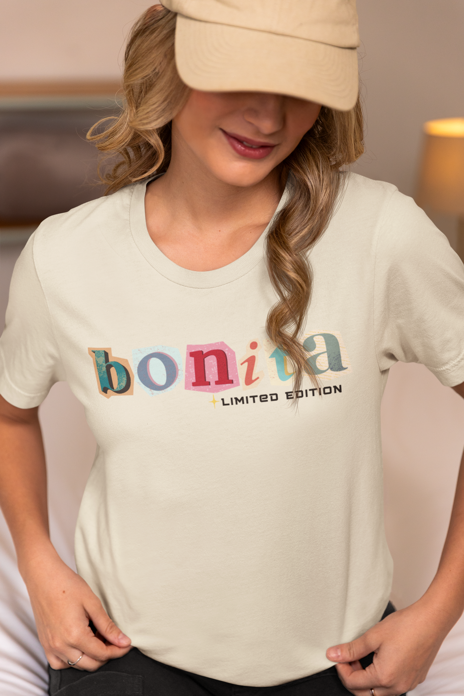 Woman wearing a beige FitBOUND T-shirt with the word “bonita” – motivational gym shirt designed for active women