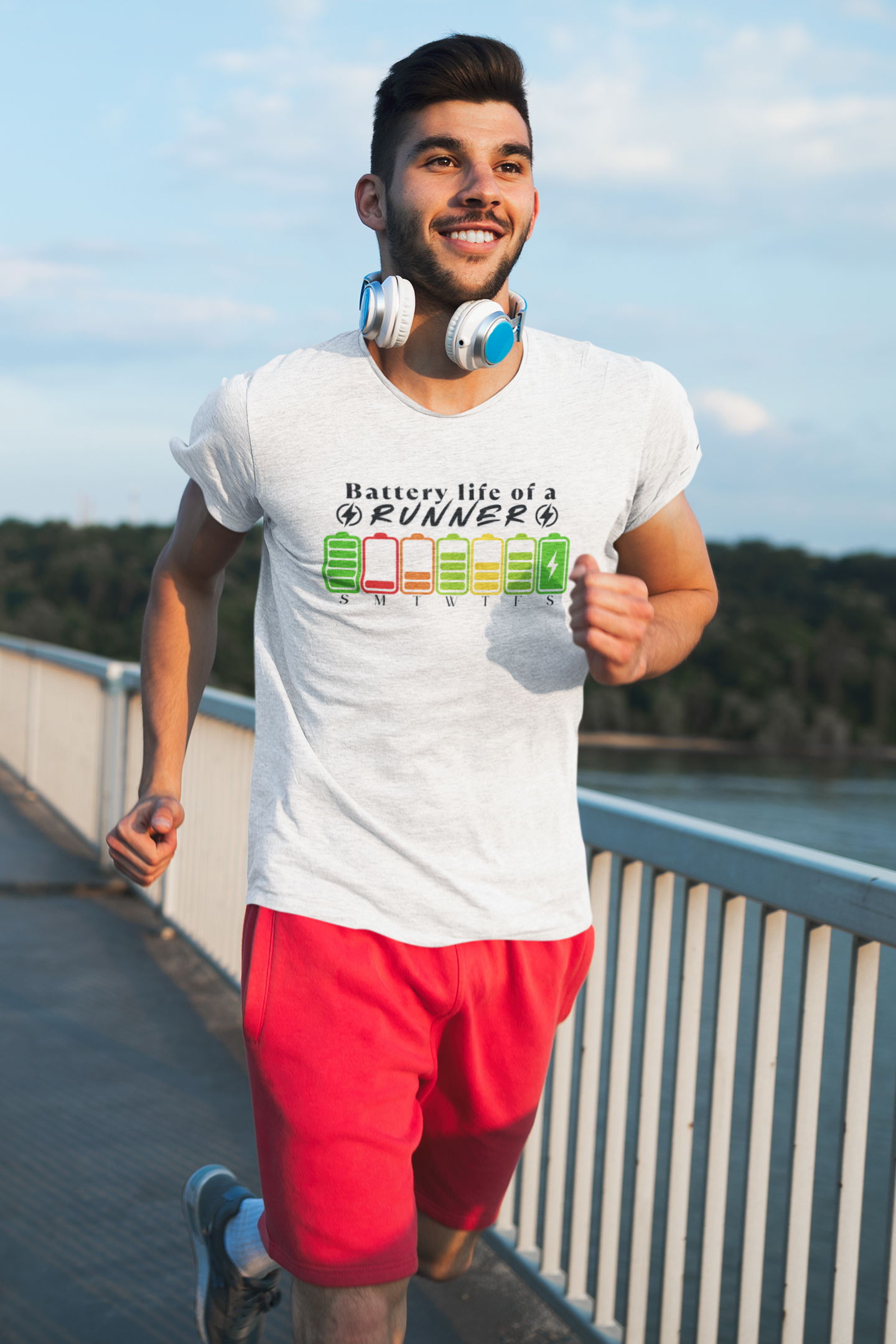 Man wearing "Battery Life of a Runner" shirt – motivational running tee with weekday battery icons