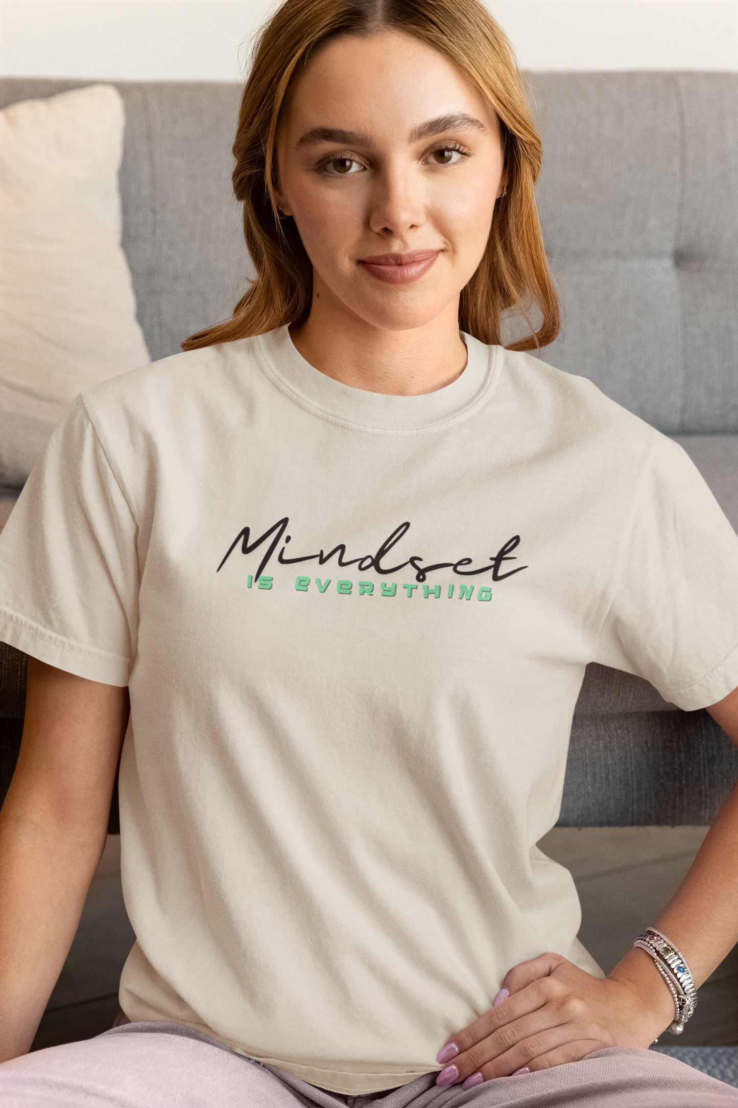 Woman wearing sand Mindset Is Everything T-Shirt – casual motivational tee.