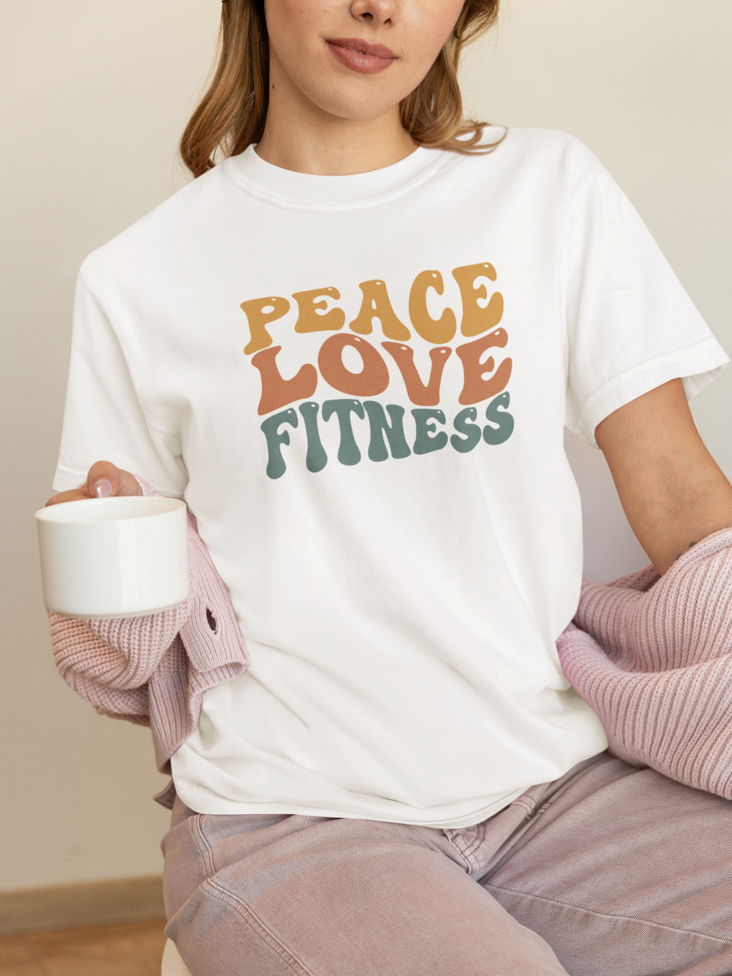 Woman wearing white Peace Love Fitness T-Shirt – casual fitness clothing.