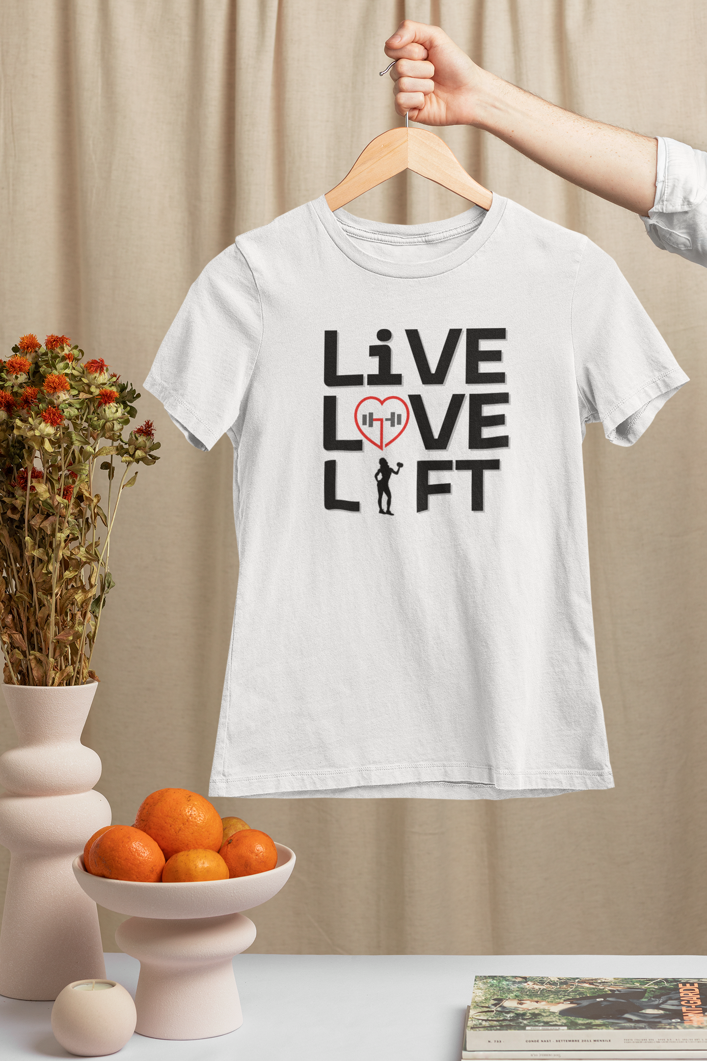 White "Live Love Lift" gym shirt hanging – motivational fitness tee for lifters and active lifestyle