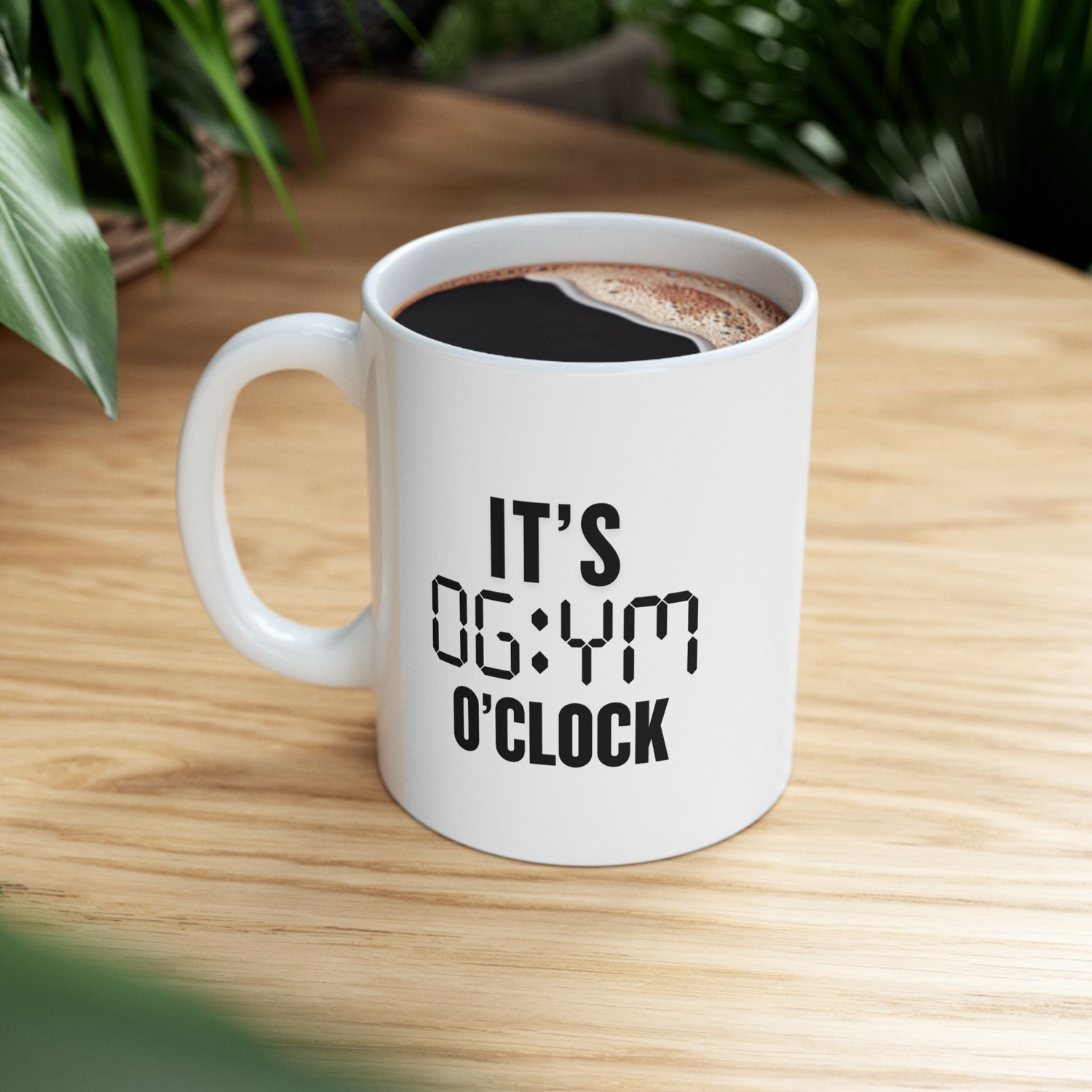 White ceramic mug on wooden table with the phrase 'It’s Gym O’Clock' – Fitness and motivational coffee cup for runners and gym lovers from FitBOUND