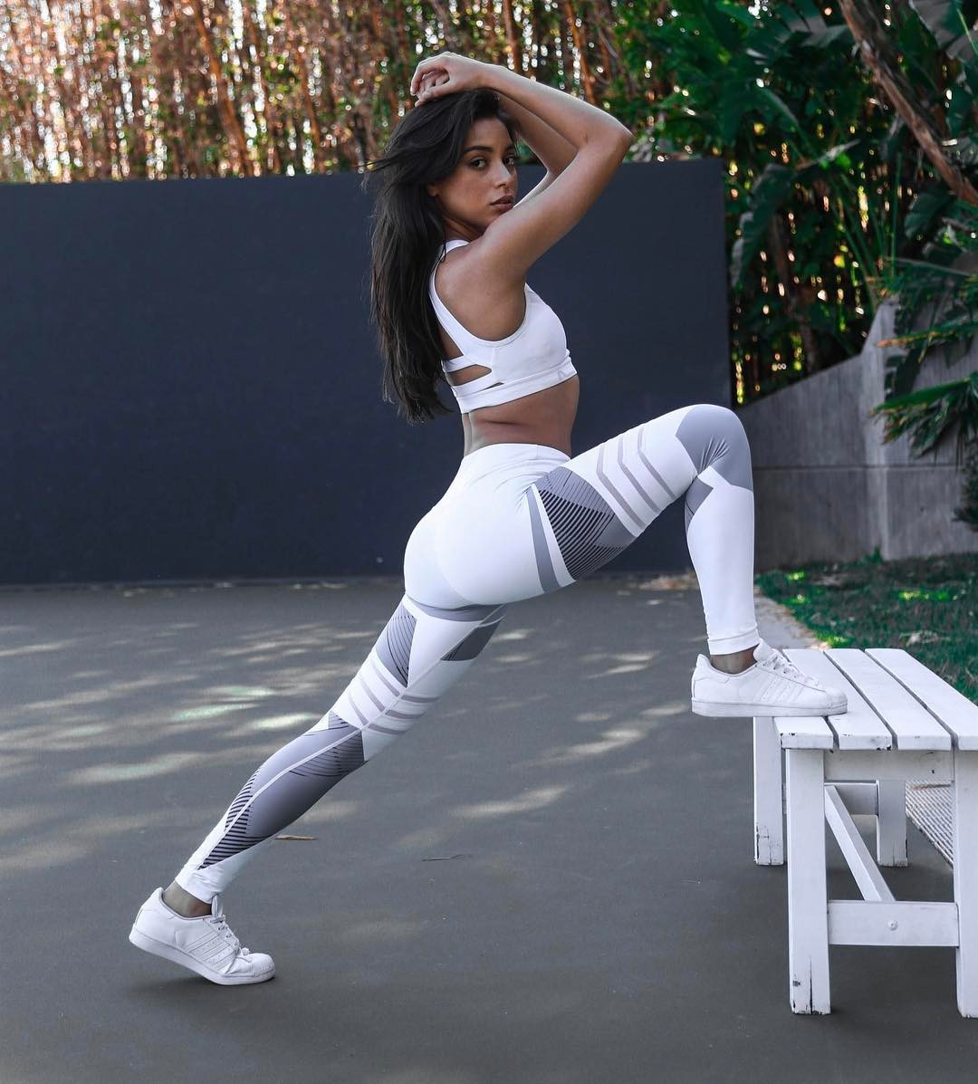 Woman squatting in performance leggings – breathable, high-stretch design ideal for strength training