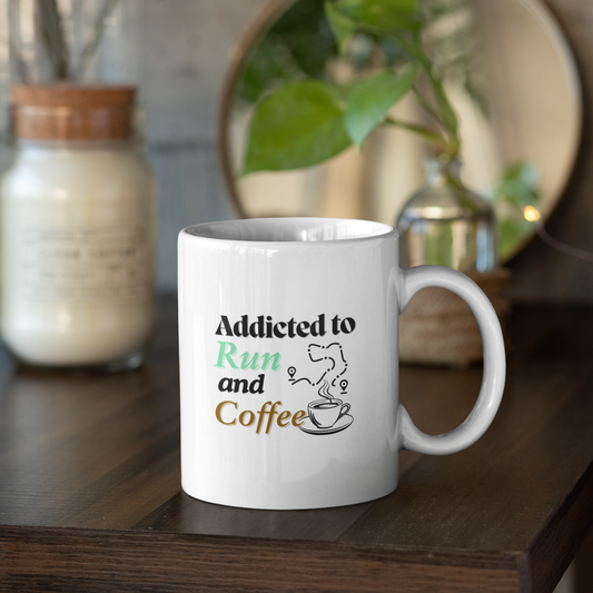 White ceramic mug on wooden table with the text "Addicted to Run and Coffee" – perfect gift for runners and coffee lovers
