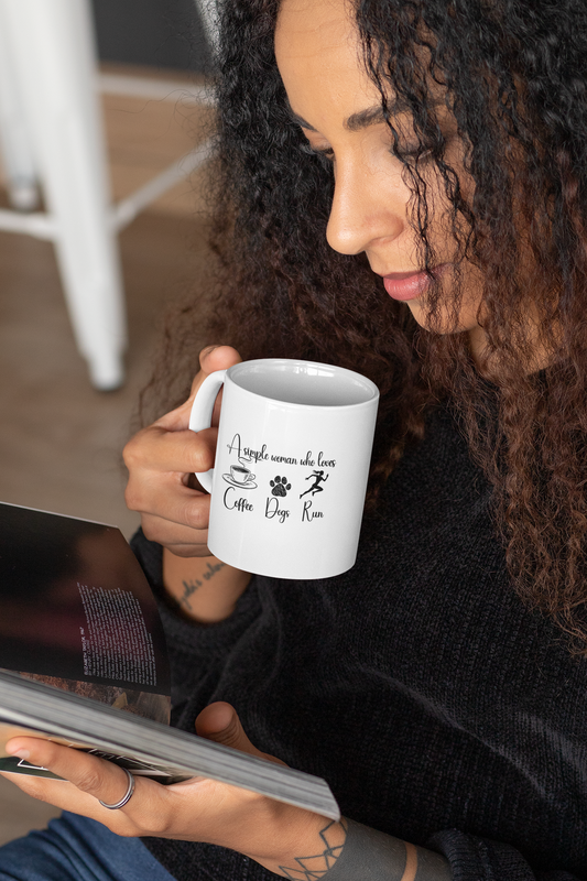 Woman holding funny coffee mug – Coffee Dogs Run design for dog lovers