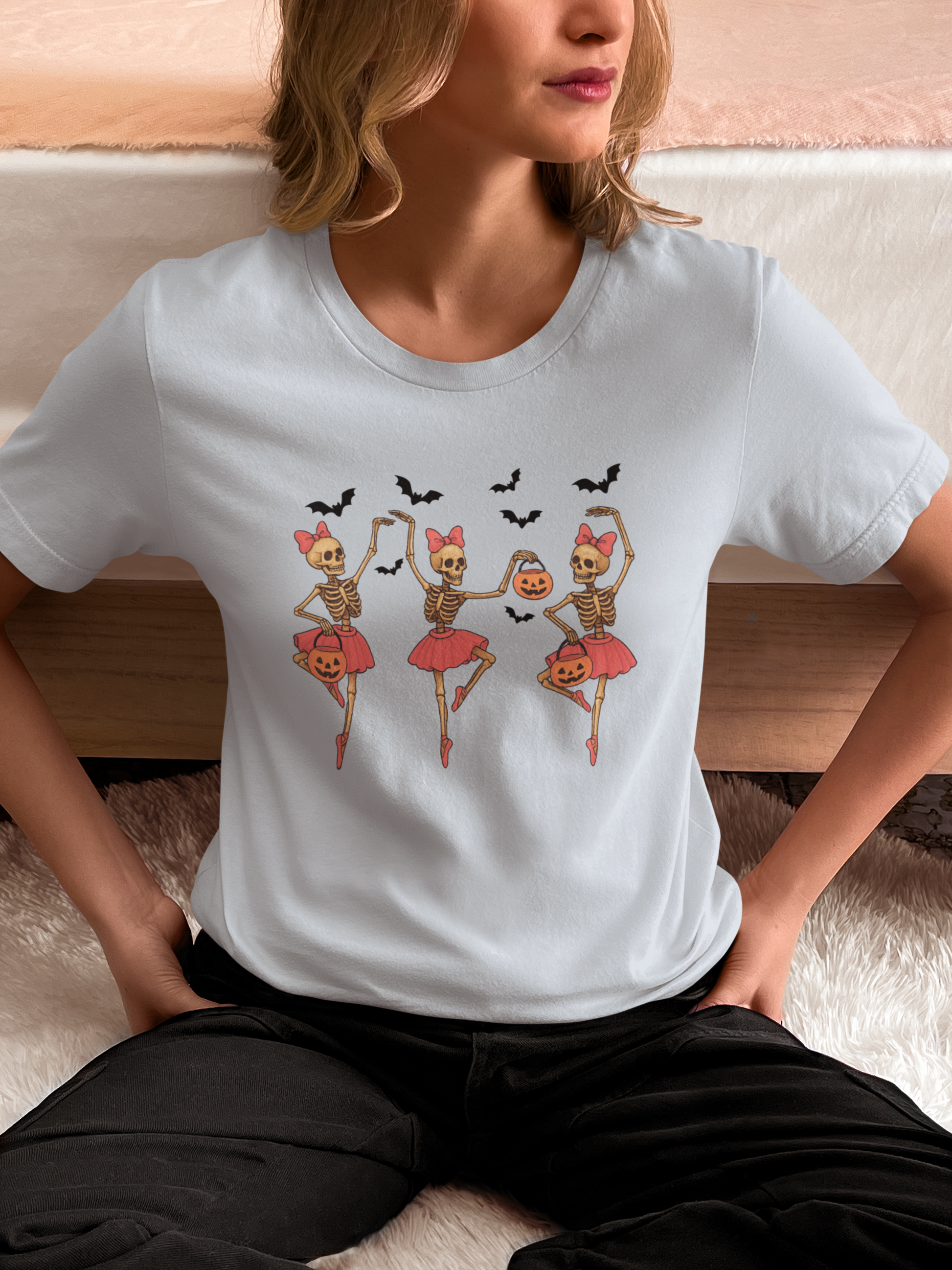 Lifestyle photo woman wearing Skeleton Ballerina Halloween T Shirt in light blue