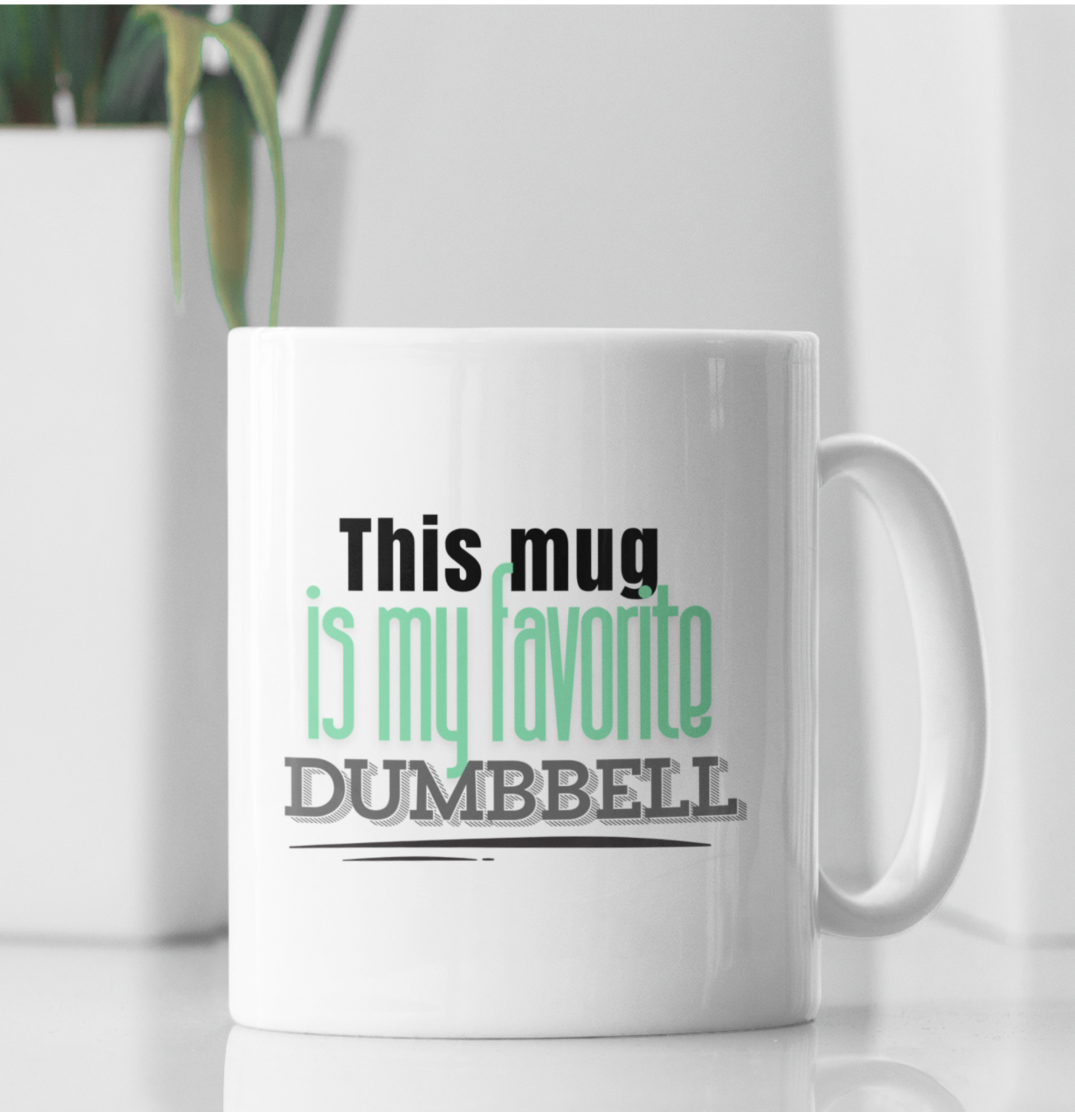 White ceramic mug with the text "This Mug Is My Favorite Dumbbell" – minimalist fitness gift for gym and coffee lovers