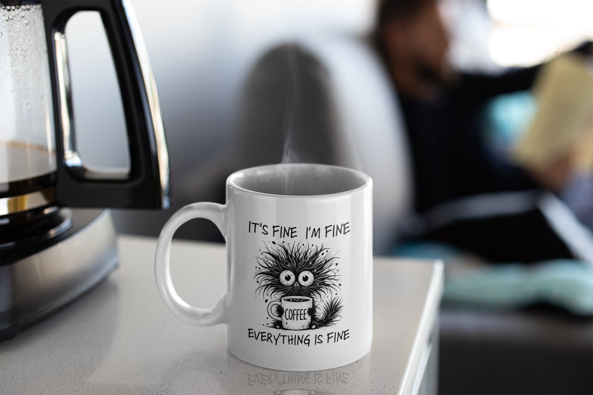 Humorous ceramic coffee mug with quirky design, placed beside laptop and glasses – great for office or work desk.