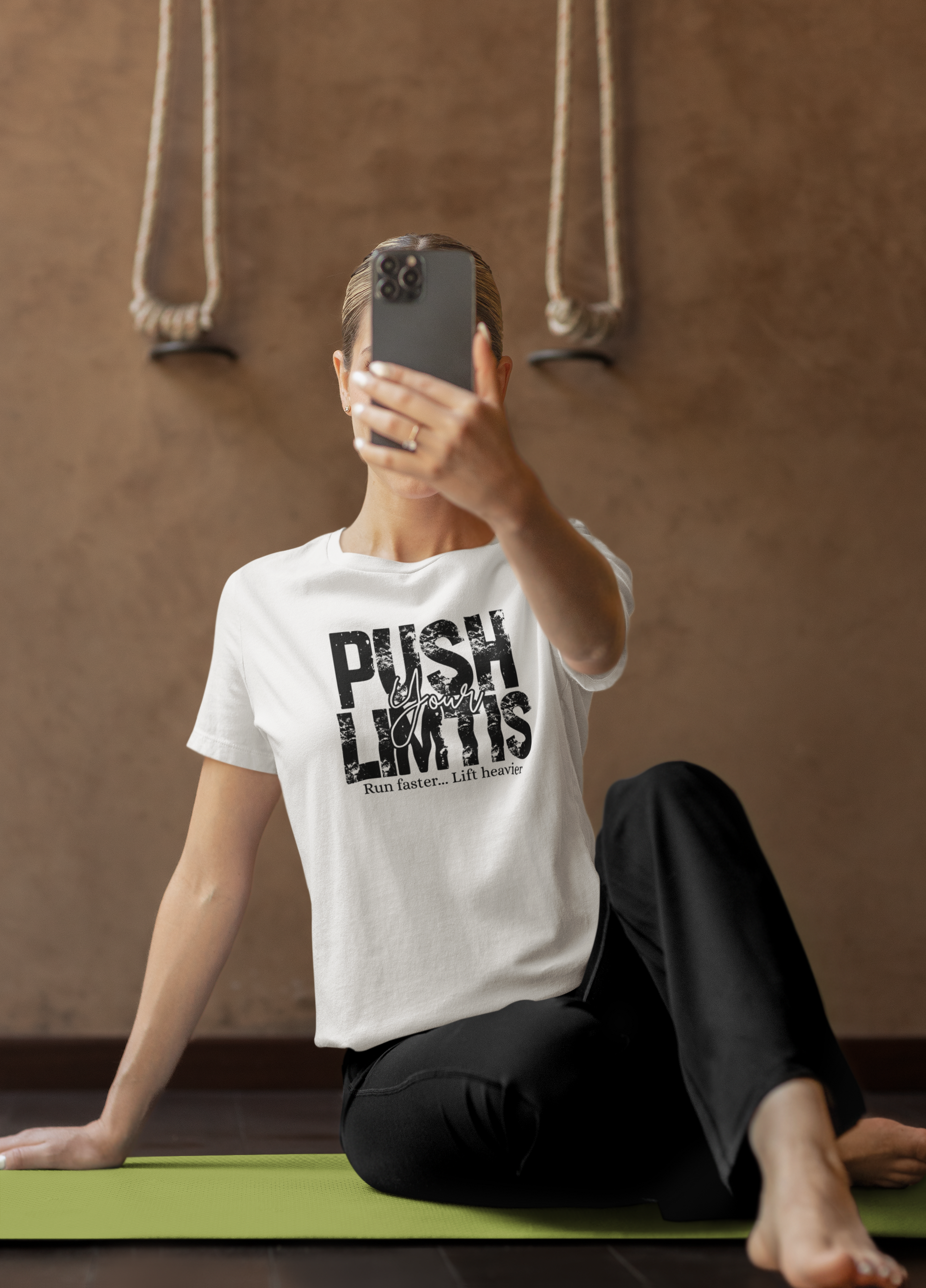 Woman wearing white “Push Your Limits” tee – motivational fitness shirt for gym sessions and workouts
