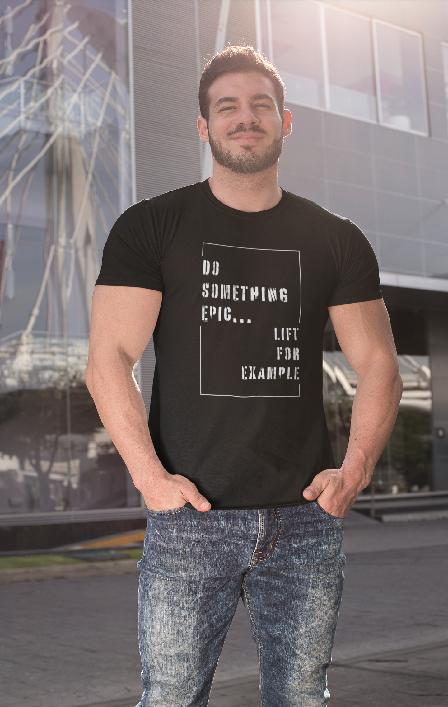 Man wearing black gym shirt with "Do Something Epic – Lift For Example" motivational quote – perfect for lifters and activewear