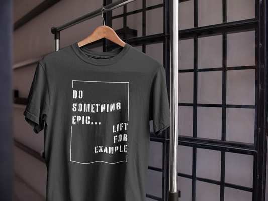 Black motivational gym t-shirt on hanger with "Do Something Epic – Lift For Example" design, ideal for lifting and fitness