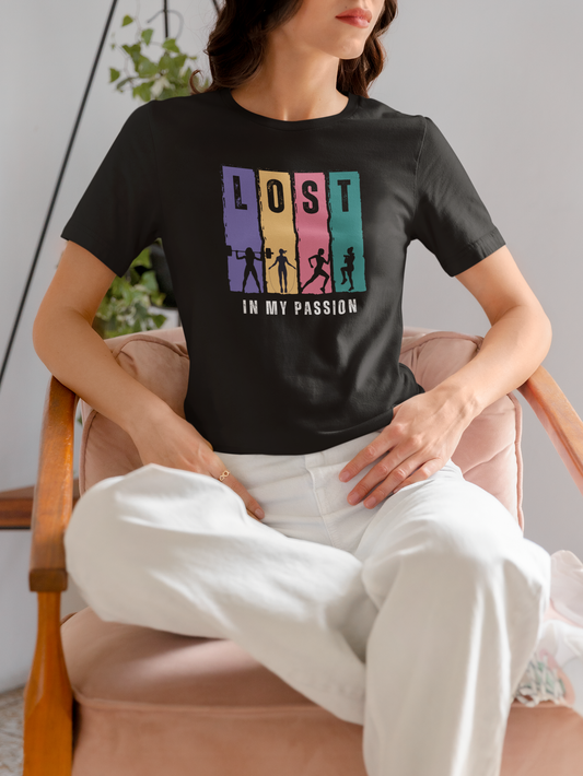 Woman wearing black Lost in My Passion t-shirt with colorful athletic silhouettes, motivational workout tee for gym and running