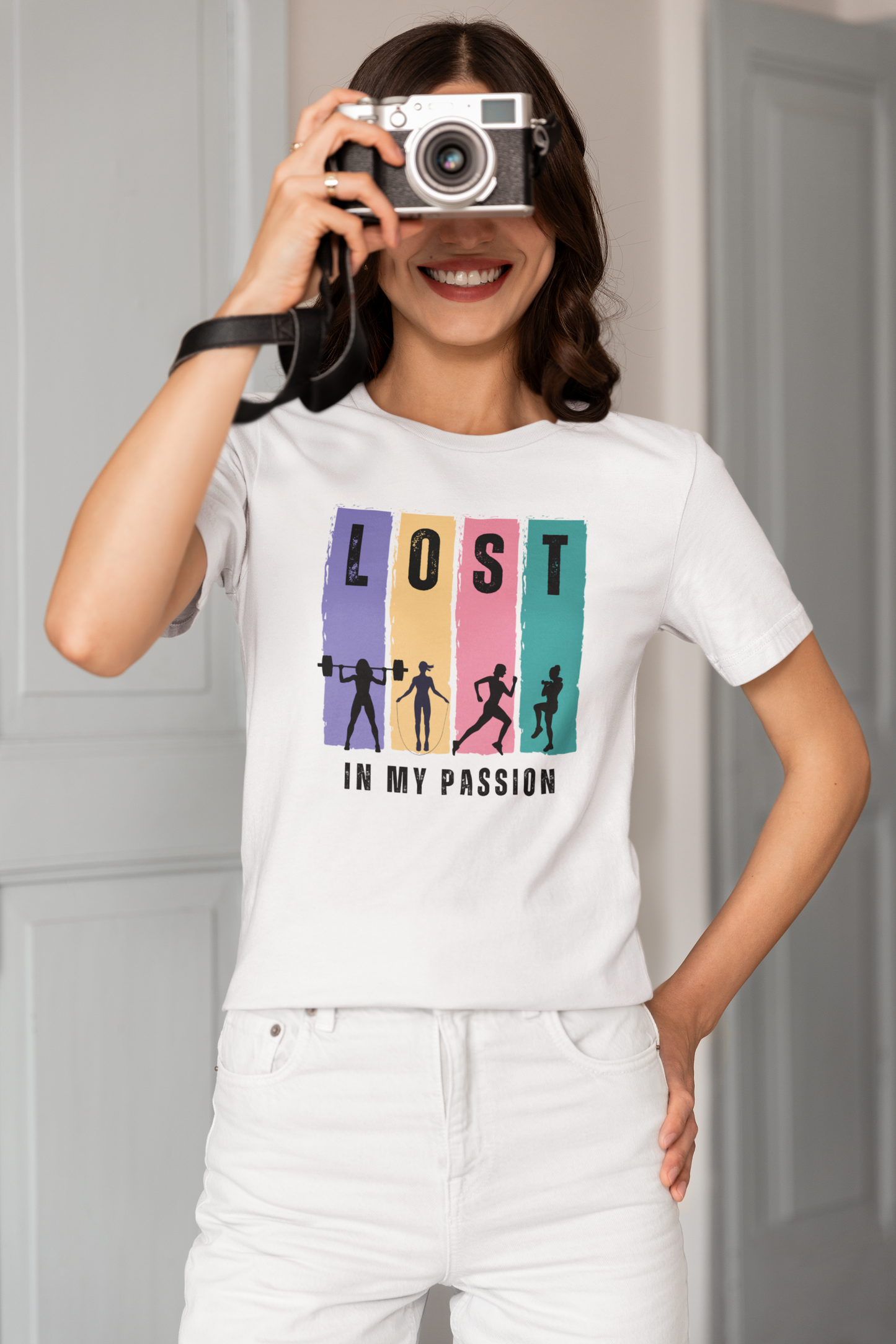 Smiling woman wearing white Lost in My Passion t-shirt, vibrant motivational fitness shirt for training and casual wear