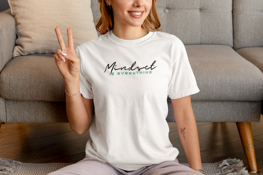 Woman sitting with white Mindset Is Everything T-Shirt – inspirational gym shirt.