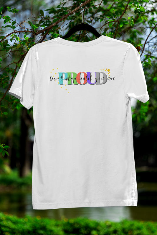 White "Train Until You're Proud" gym shirt hanging outdoors – motivational fitness tee for active lifestyles