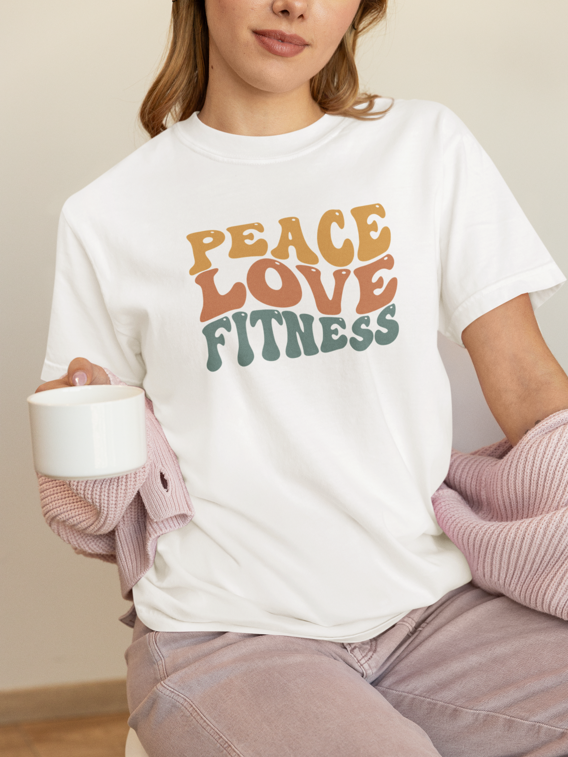Woman wearing white Peace Love Fitness T-Shirt – casual fitness clothing.
