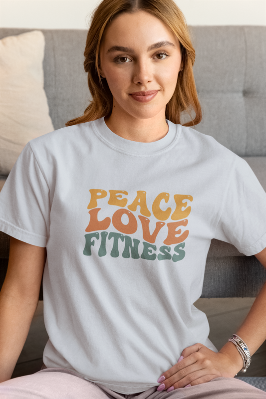Woman wearing Peace Love Fitness T-Shirt in gray – retro unisex fitness apparel.