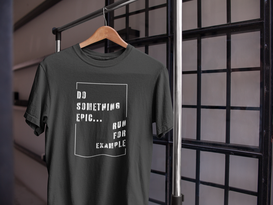 Black motivational t-shirt hanging on wooden hanger near window – Do Something Epic Run for Example design