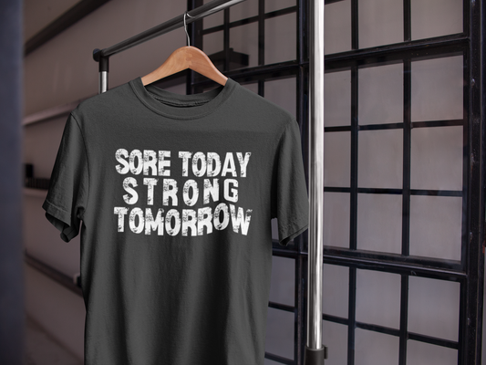 Black gym t-shirt on hanger with "Sore Today Strong Tomorrow" motivational quote – fitness apparel flatlay