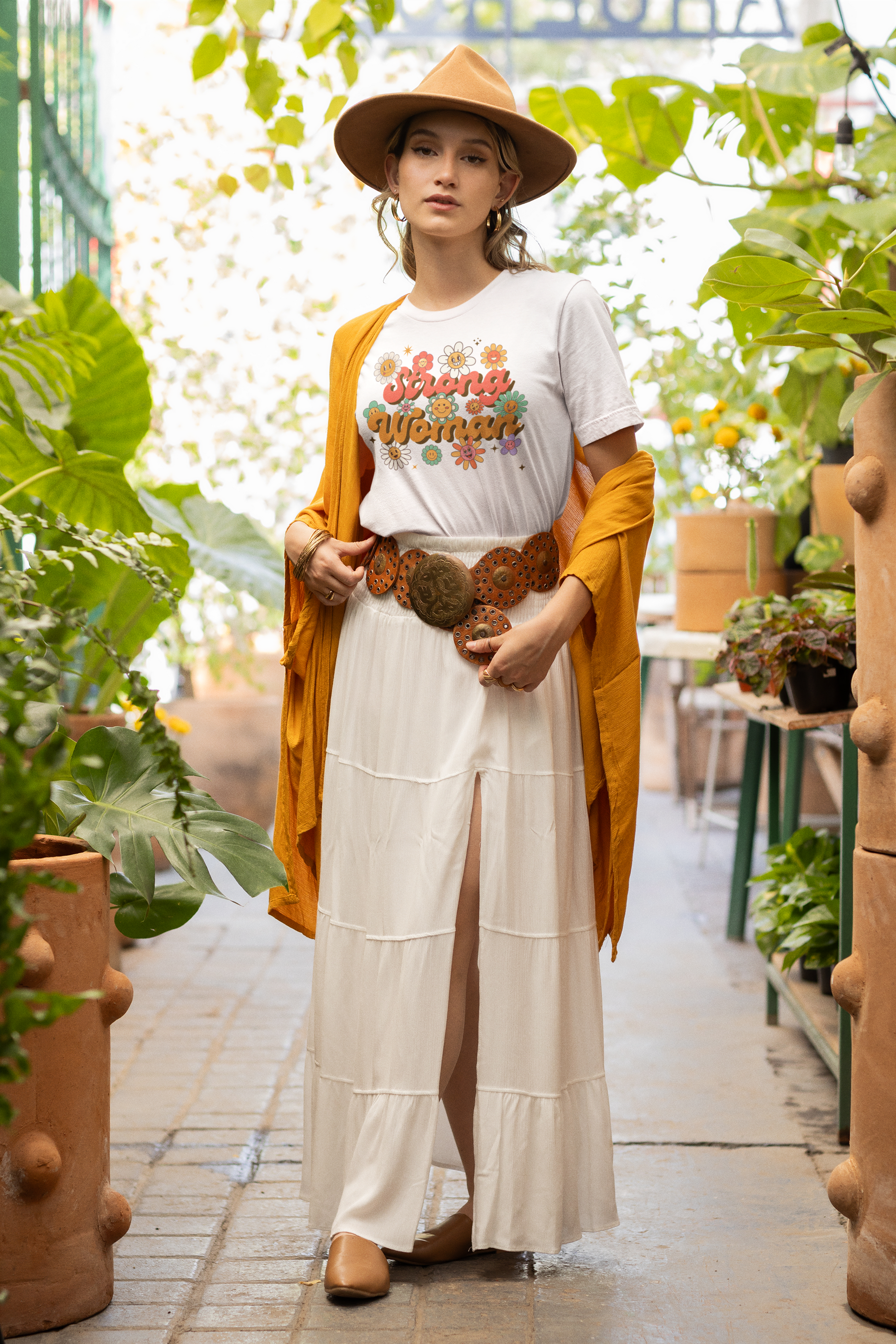 Woman outdoors wearing beige Strong Woman T-shirt – retro floral empowerment tee