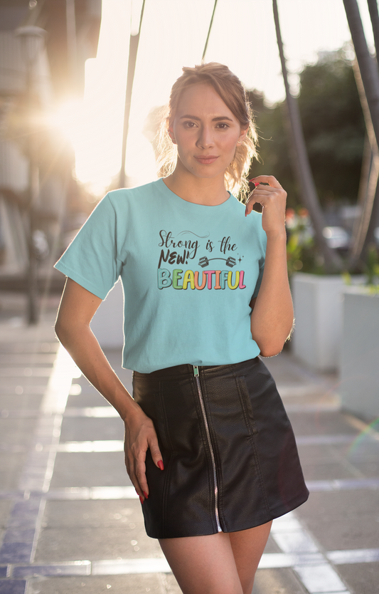 Woman wearing "Strong is the New Beautiful" t-shirt – casual fitness lifestyle look