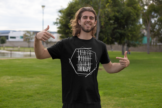 Person wearing “Exercise Therapy” tee in outdoor park – promoting movement as mental therapy