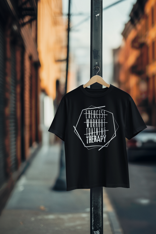 Black “Exercise Therapy” t-shirt hanging on post – activewear style with urban gym vibe