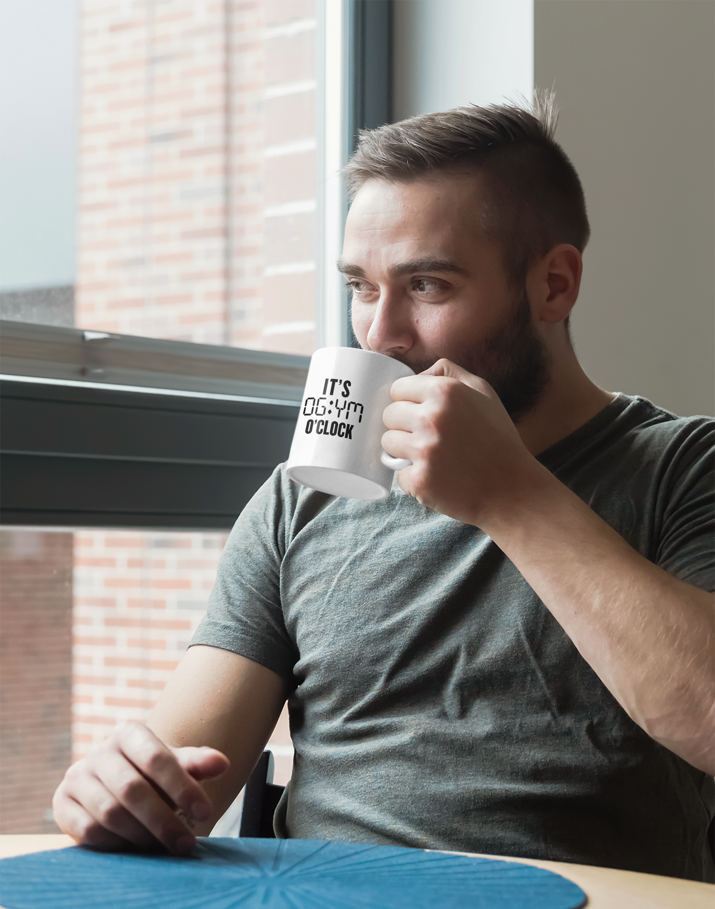Man drinking from It’s Gym O’Clock fitness mug – casual morning routine