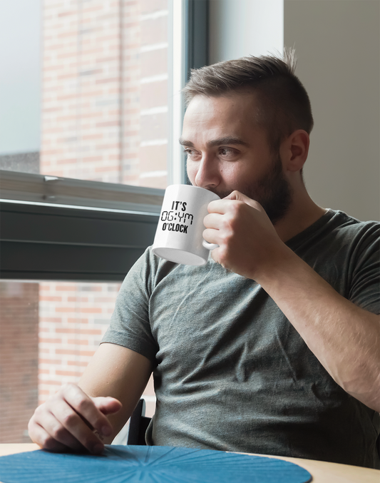 Man drinking from It’s Gym O’Clock fitness mug – casual morning routine