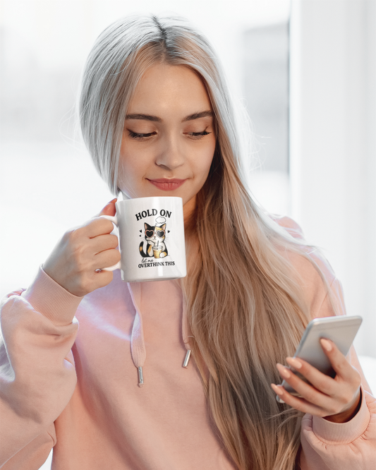 Woman drinking from cat coffee mug with motivational funny quote
